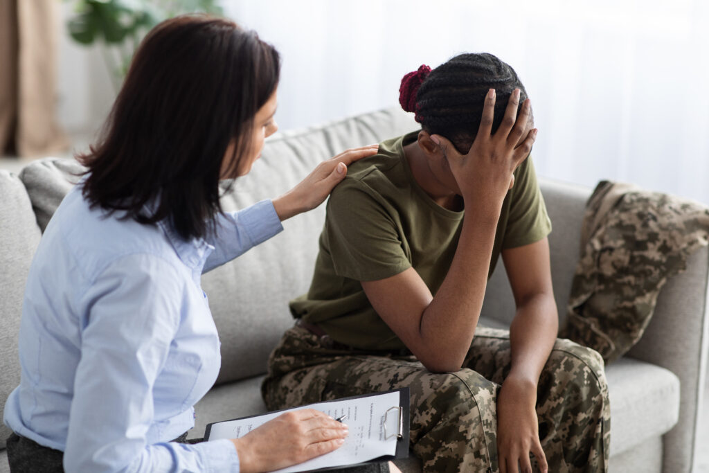 female psychologist comforting black soldier lady 2023 11 27 05 34 02 utc After Action an AM Health Care Program