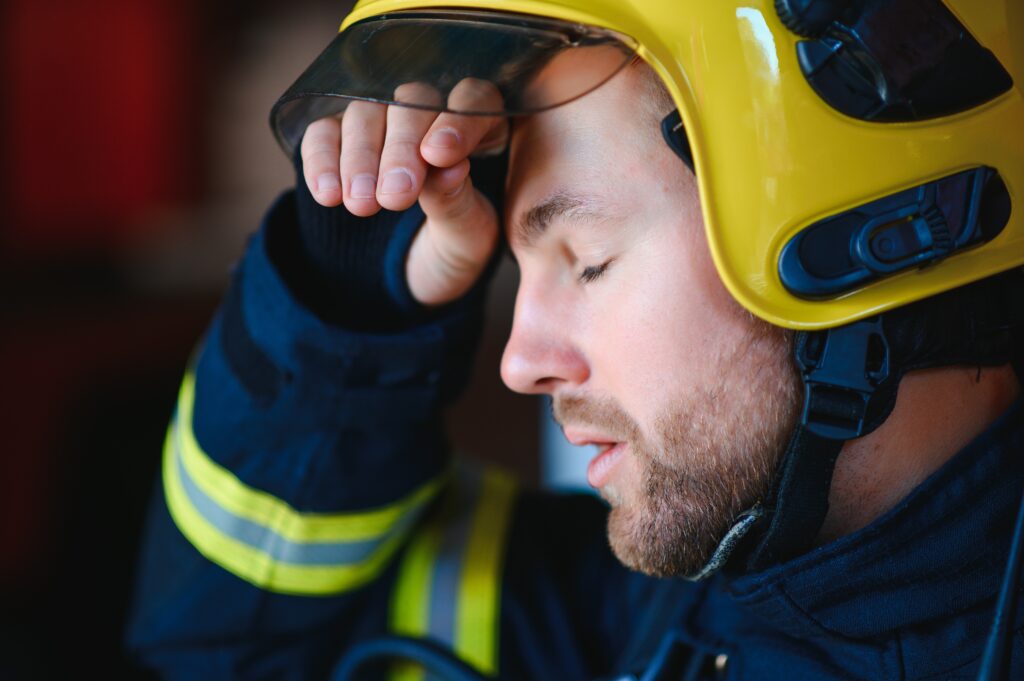 A first responder sitting in a calm, serene environment practicing mindfulness as a coping strategy to deal with trauma effectively.