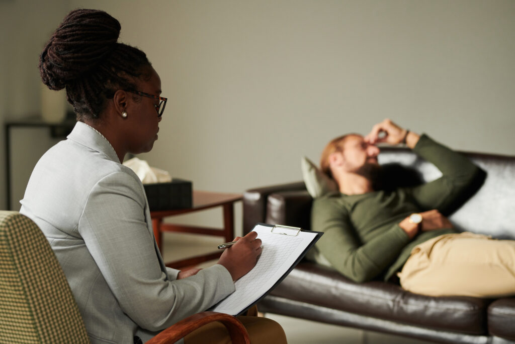 psychologist making notes in card during her work 2023 11 27 05 36 48 utc After Action an AM Health Care Program