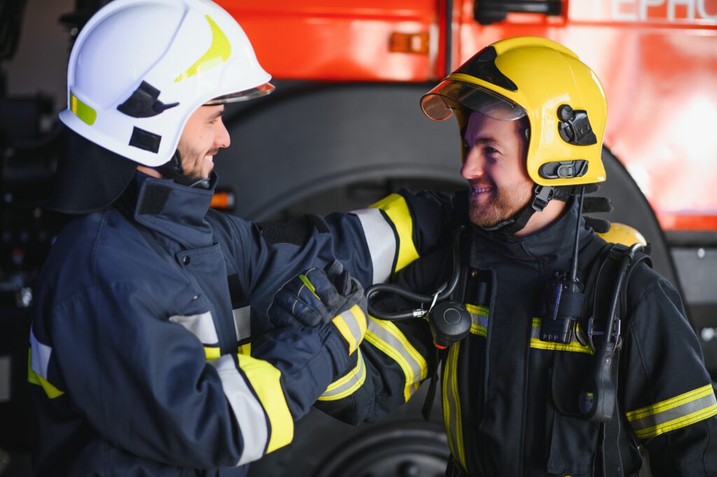 two firefighters in protective clothing in helmets 2024 04 01 16 42 15 utc After Action an AM Health Care Program