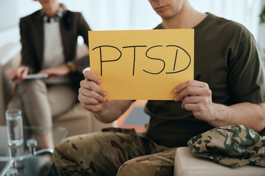 close up of veteran holding ptsd placard at mental 2023 11 27 04 50 31 utc After Action an AM Health Care Program