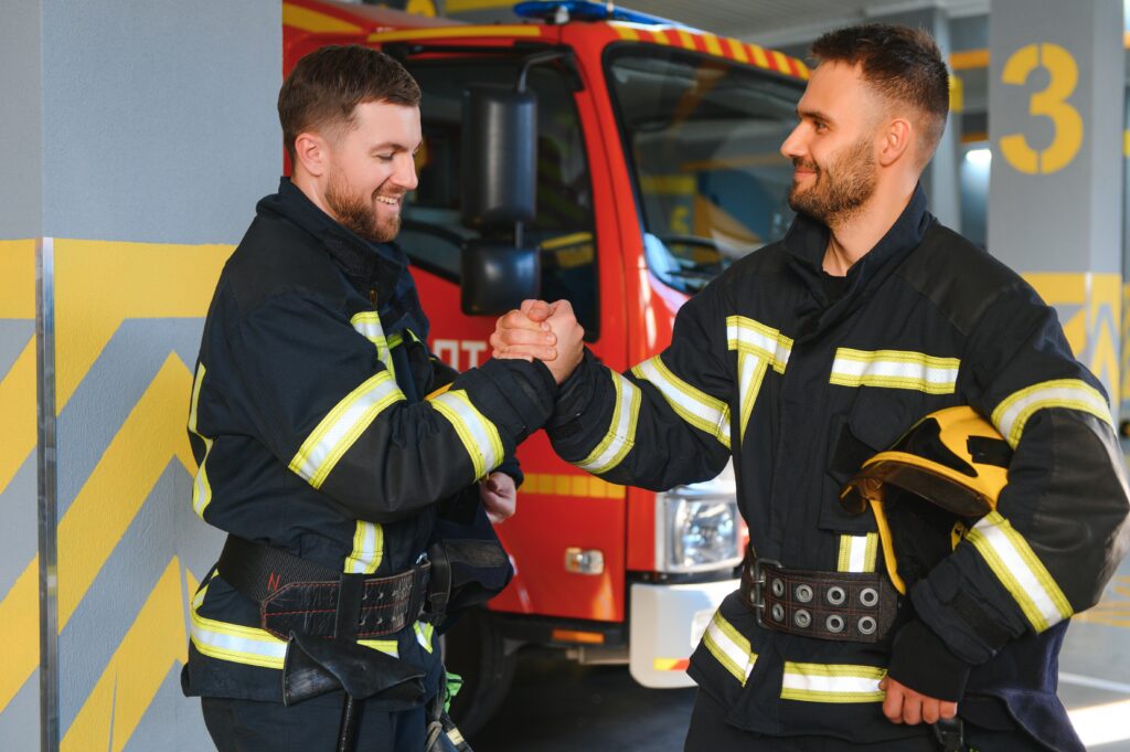 portrait of two young firemen in uniform standing 2024 07 05 17 21 31 utc After Action an AM Health Care Program