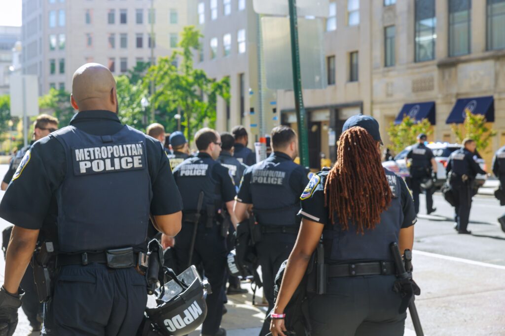 A group of police officers standing together, symbolizing the importance of peer support and suicide prevention for first responders.