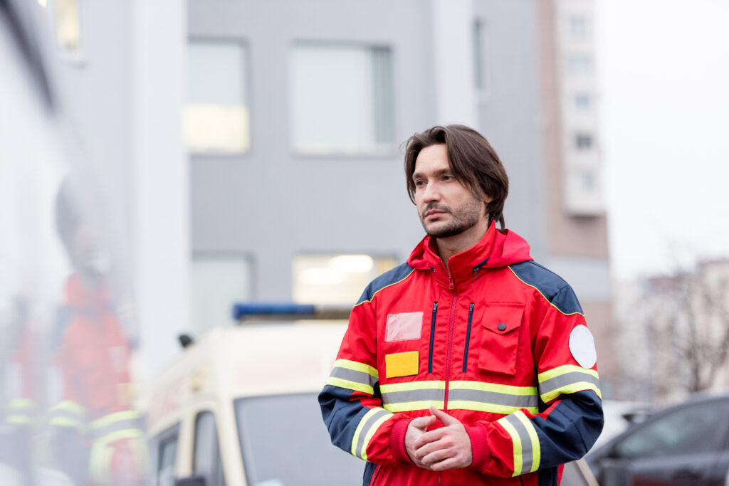 A paramedic practicing ADHD stress management techniques, using mindfulness to stay calm and focused during an emergency situation.

