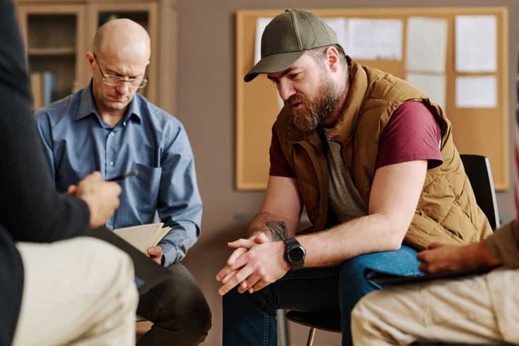 A first responder participates in a peer support group, emphasizing the connection between first responder mental health and operational readiness.