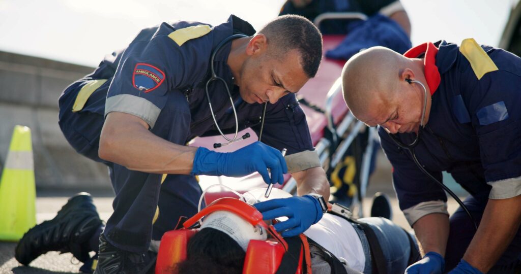 first responders attending a patient on the side of the road